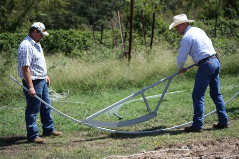 bending metal for hop houses with peak|high tunnel hoop benders.